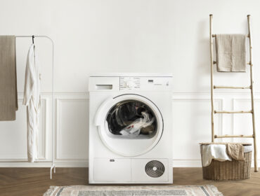 Washing machine in a minimal laundry room interior design